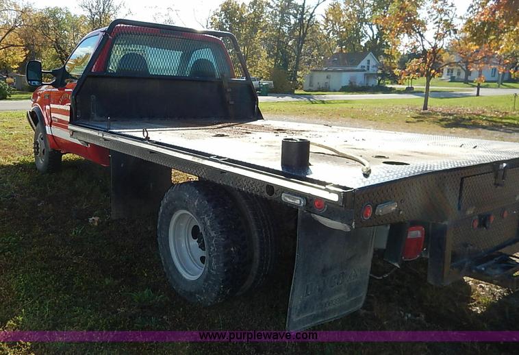 image for item I5324 2003 Ford F350 Super Duty XL flatbed pickup truck