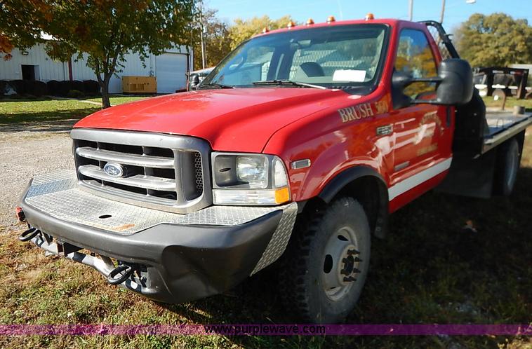 image for item I5324 2003 Ford F350 Super Duty XL flatbed pickup truck