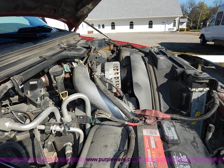 image for item I5324 2003 Ford F350 Super Duty XL flatbed pickup truck