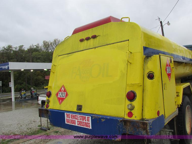 image for item I8910 1999 Freightliner FL70 fuel truck