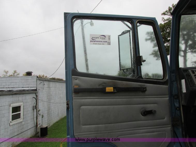 image for item I8910 1999 Freightliner FL70 fuel truck