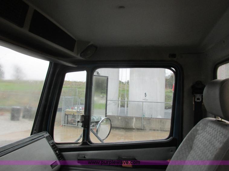 image for item I8910 1999 Freightliner FL70 fuel truck