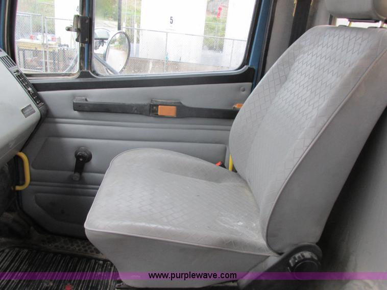 image for item I8910 1999 Freightliner FL70 fuel truck