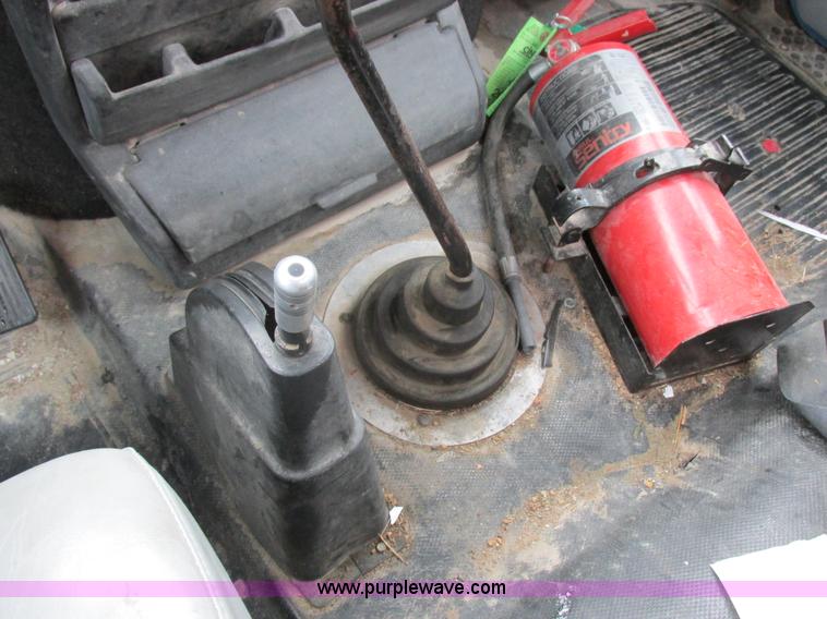 image for item I8910 1999 Freightliner FL70 fuel truck