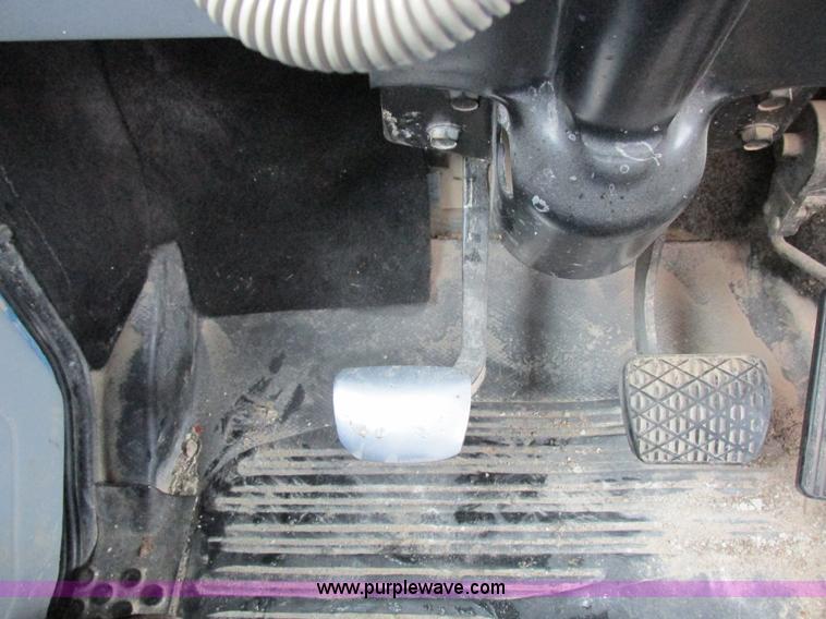 image for item I8910 1999 Freightliner FL70 fuel truck