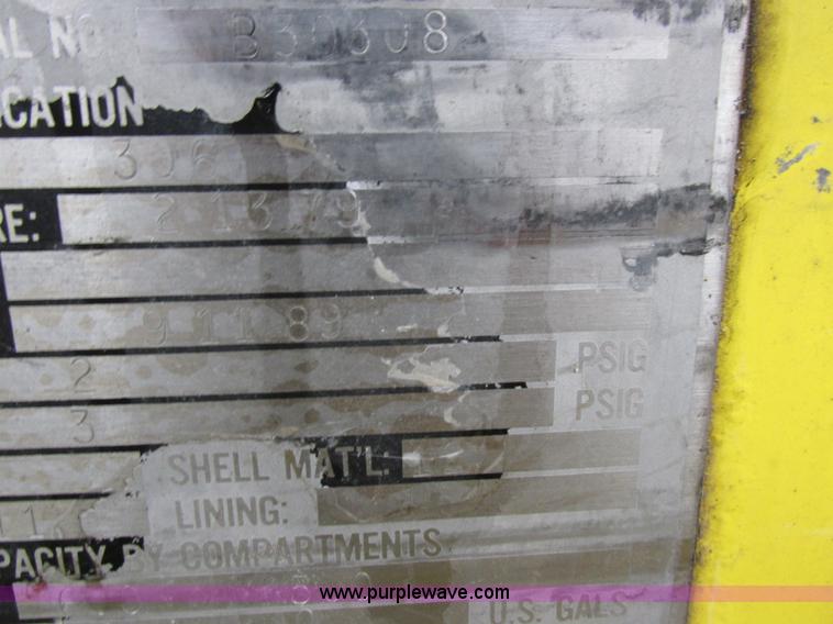 image for item I8910 1999 Freightliner FL70 fuel truck