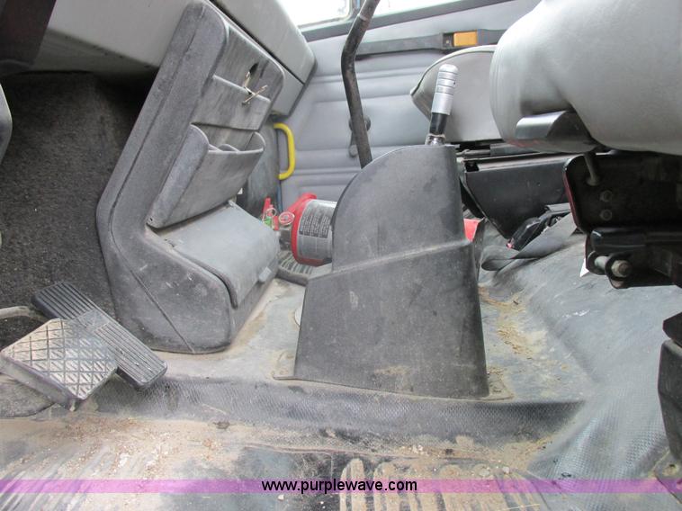 image for item I8910 1999 Freightliner FL70 fuel truck