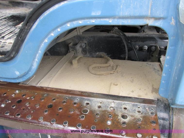 image for item I8910 1999 Freightliner FL70 fuel truck