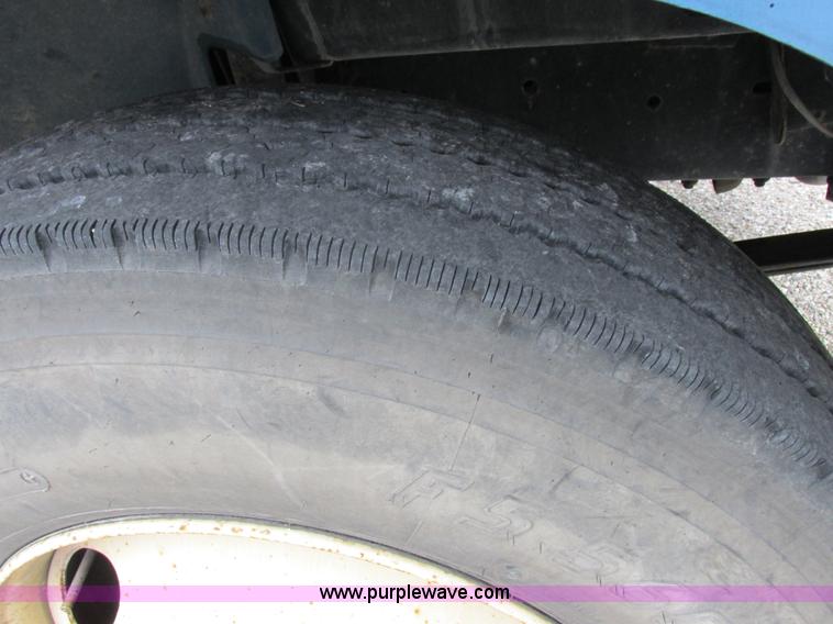 image for item I8910 1999 Freightliner FL70 fuel truck