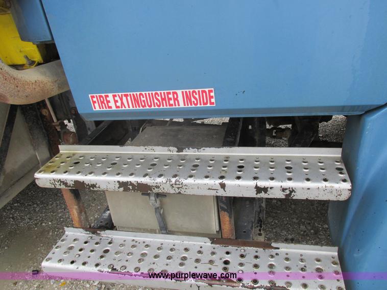 image for item I8910 1999 Freightliner FL70 fuel truck