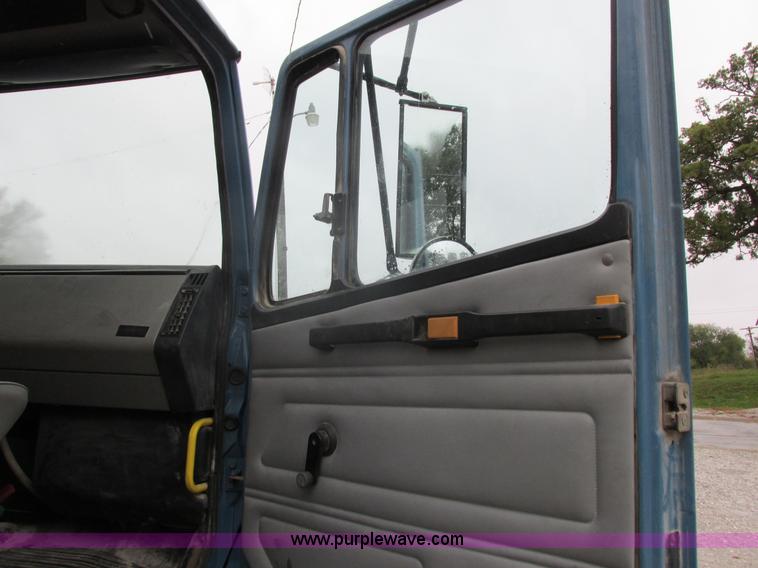 image for item I8910 1999 Freightliner FL70 fuel truck