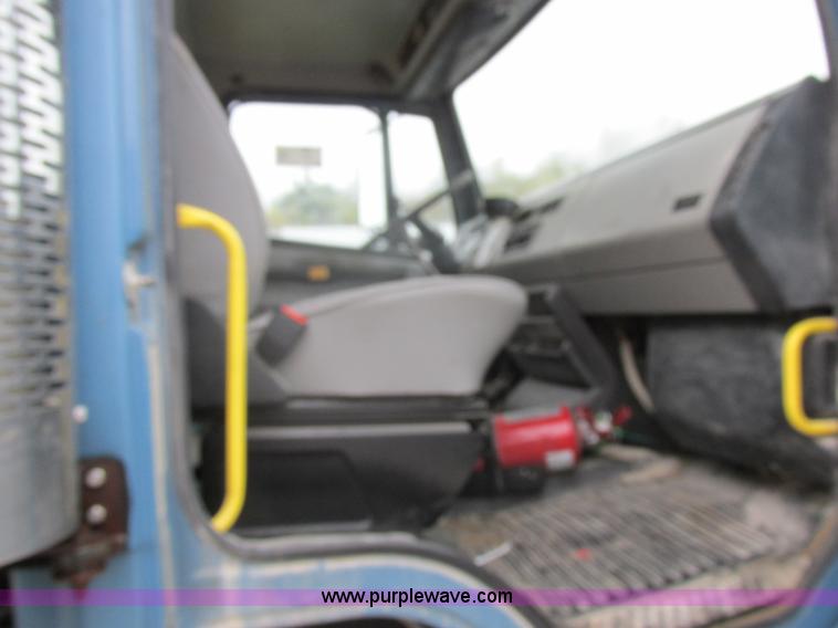 image for item I8910 1999 Freightliner FL70 fuel truck