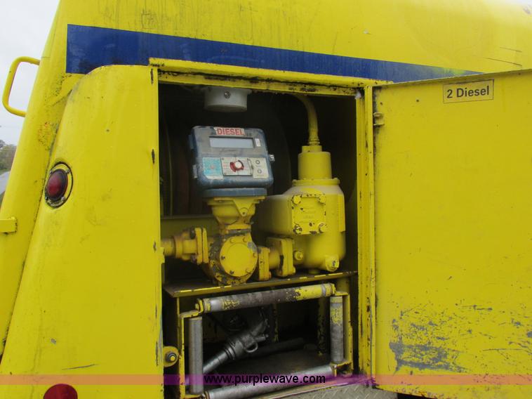 image for item I8910 1999 Freightliner FL70 fuel truck