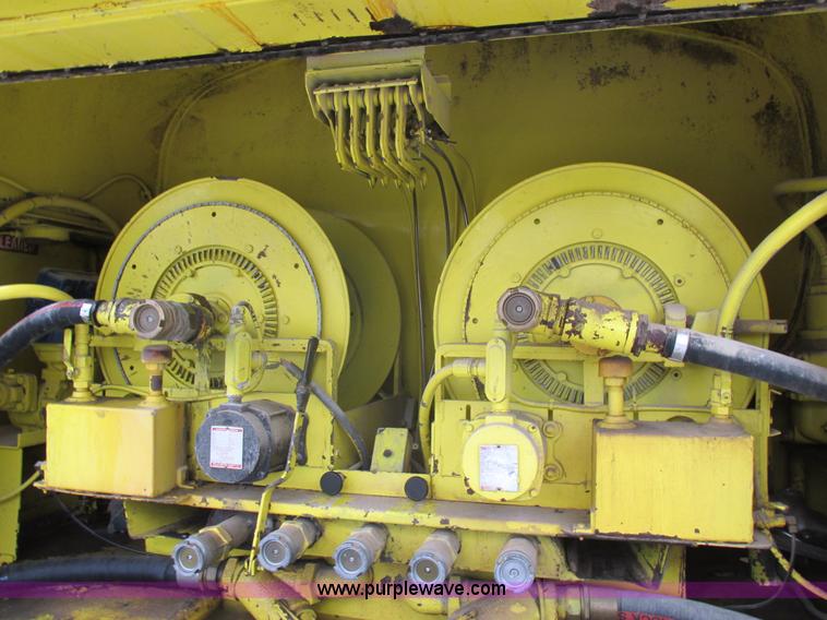 image for item I8910 1999 Freightliner FL70 fuel truck