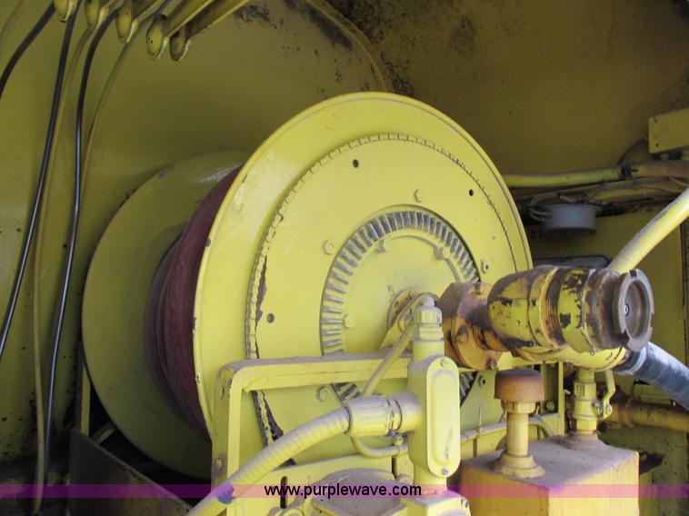 image for item I8910 1999 Freightliner FL70 fuel truck