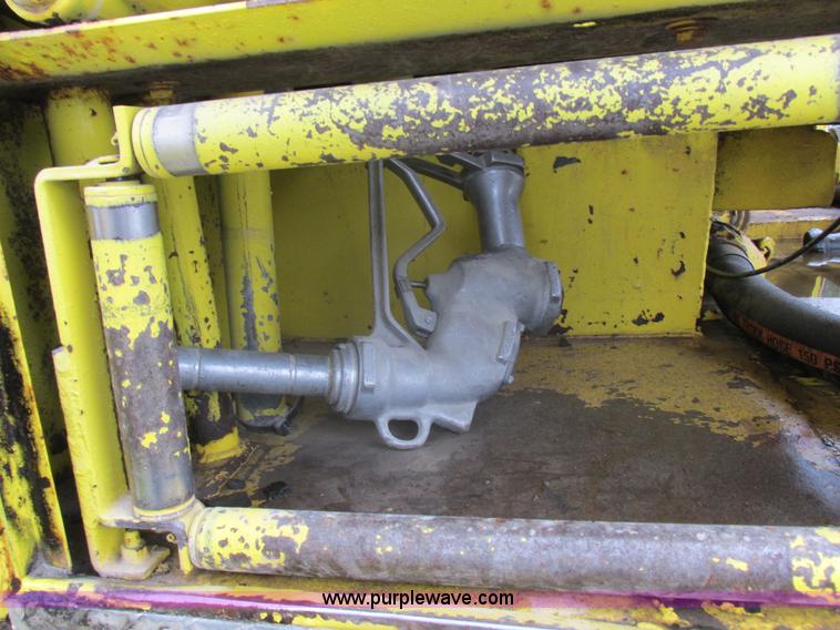 image for item I8910 1999 Freightliner FL70 fuel truck