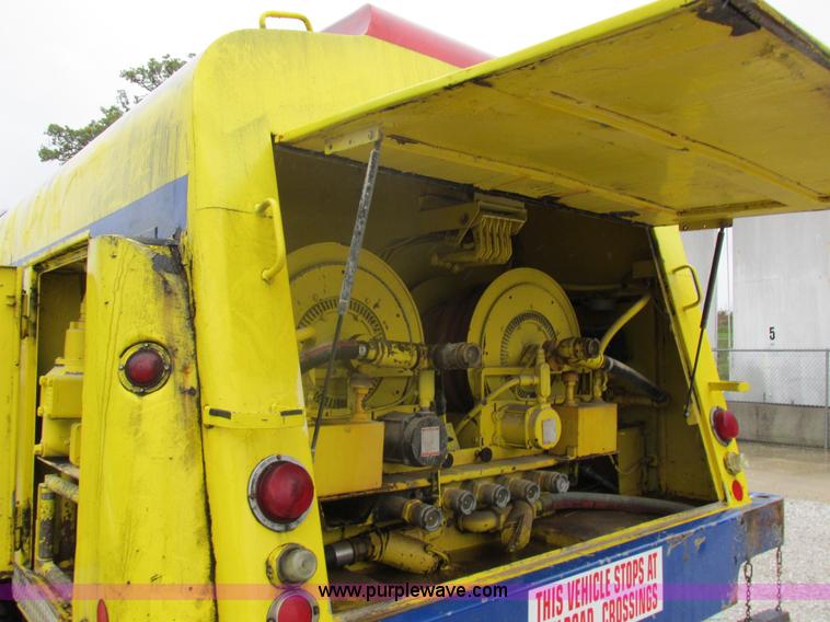 image for item I8910 1999 Freightliner FL70 fuel truck