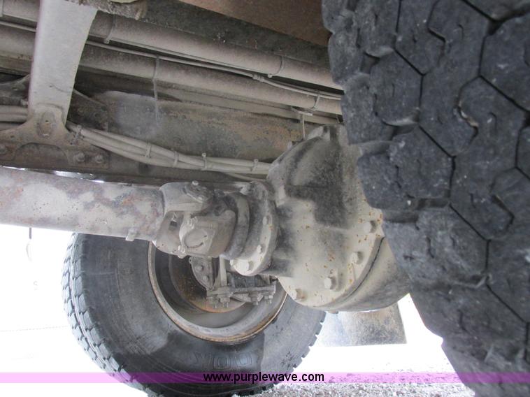 image for item I8910 1999 Freightliner FL70 fuel truck