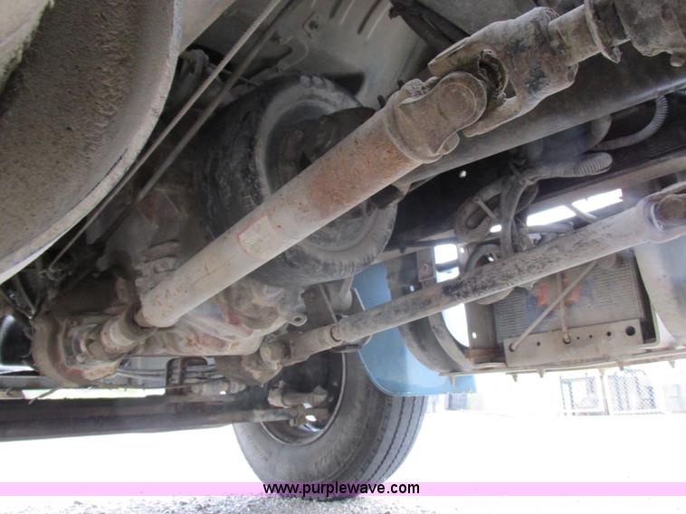 image for item I8910 1999 Freightliner FL70 fuel truck