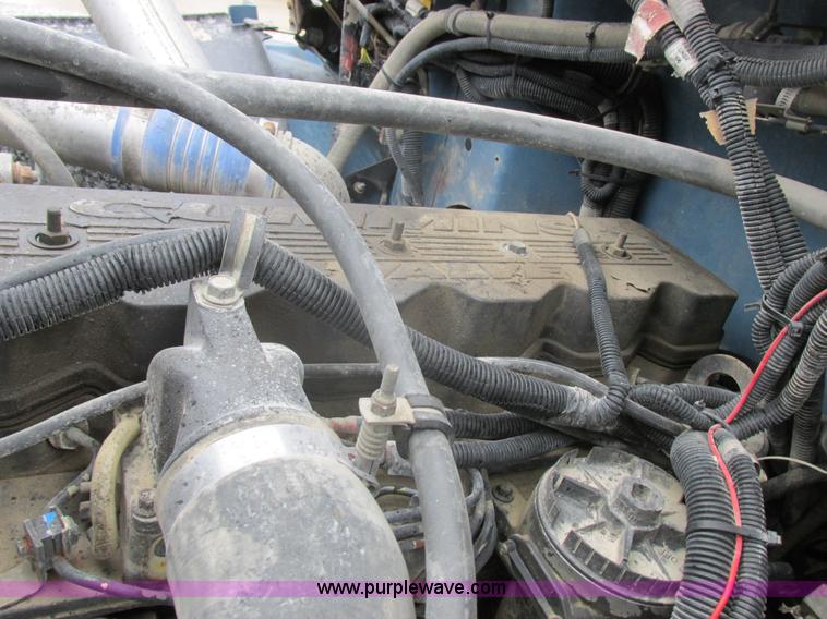 image for item I8910 1999 Freightliner FL70 fuel truck