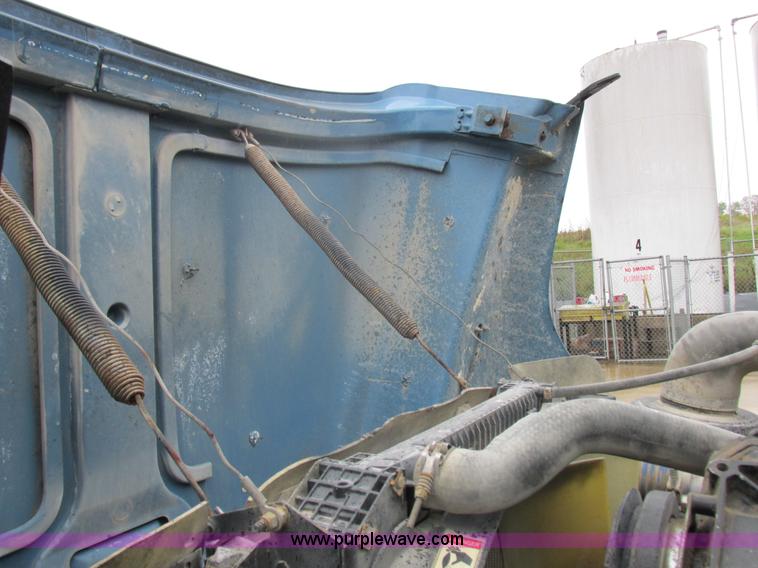 image for item I8910 1999 Freightliner FL70 fuel truck