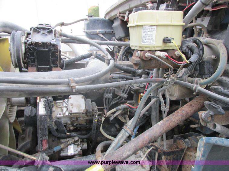 image for item I8910 1999 Freightliner FL70 fuel truck