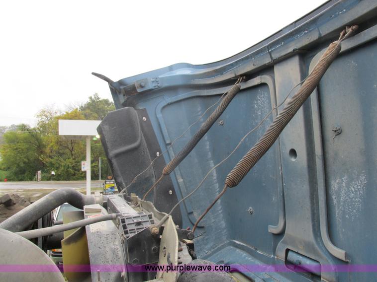 image for item I8910 1999 Freightliner FL70 fuel truck