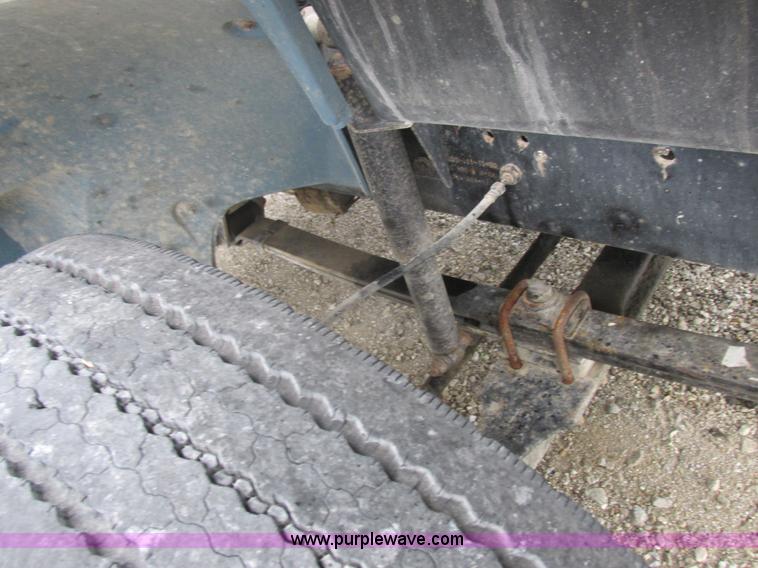 image for item I8910 1999 Freightliner FL70 fuel truck