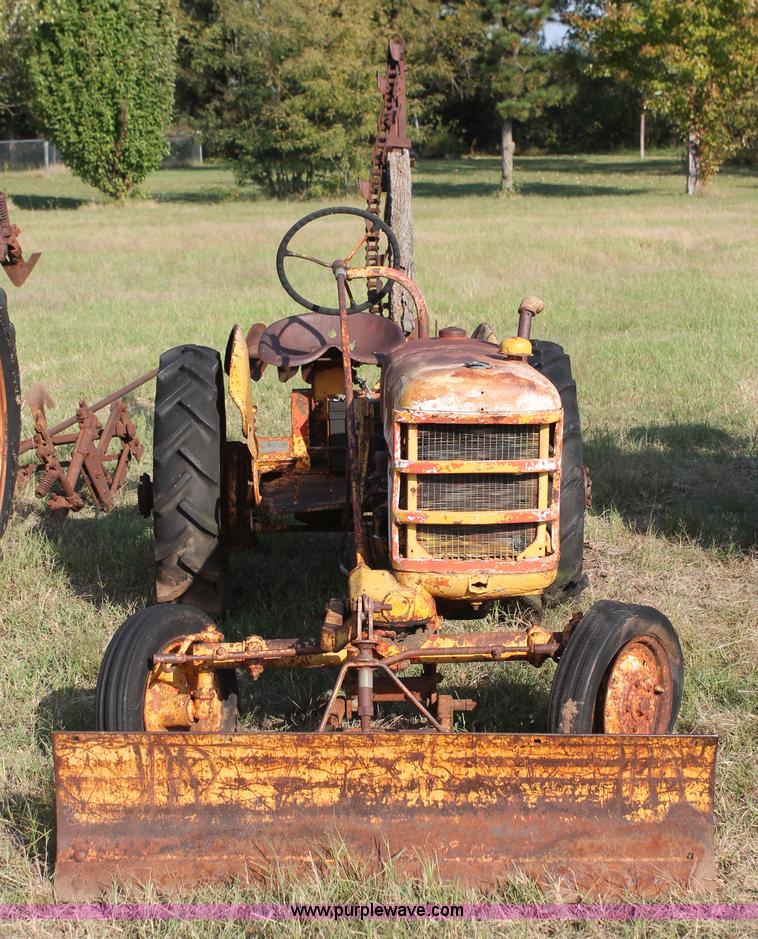 image for item H5588 1948 McCormick Farmall Cub Lowboy tractor with trencher