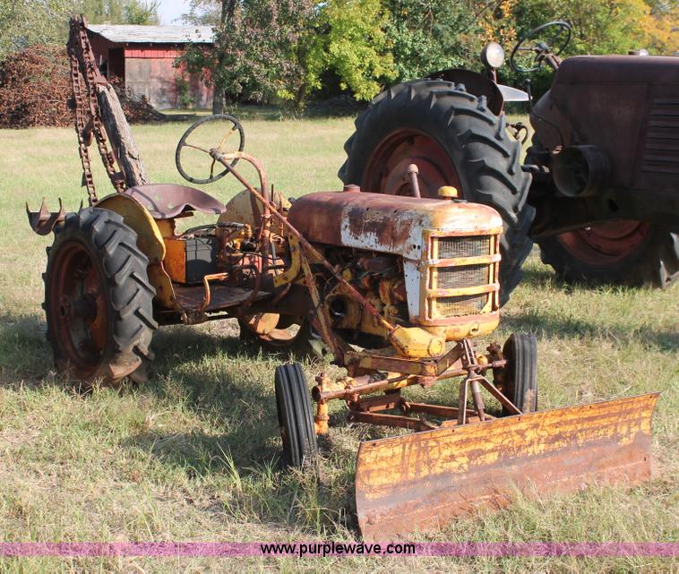 image for item H5588 1948 McCormick Farmall Cub Lowboy tractor with trencher