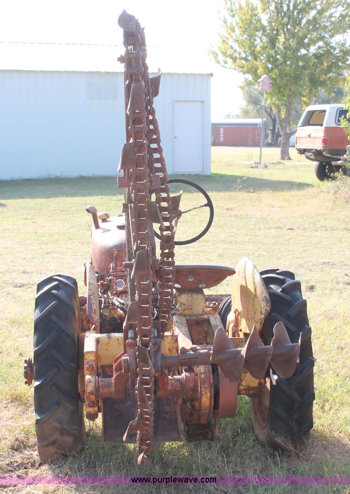 image for item H5588 1948 McCormick Farmall Cub Lowboy tractor with trencher