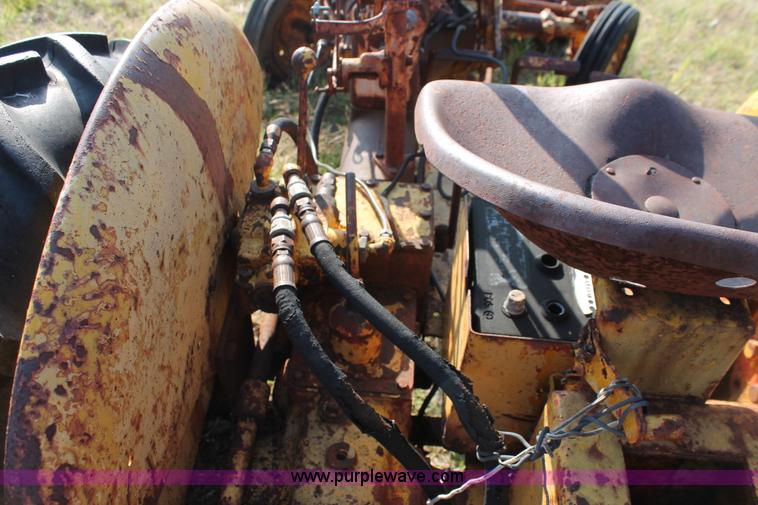 image for item H5588 1948 McCormick Farmall Cub Lowboy tractor with trencher