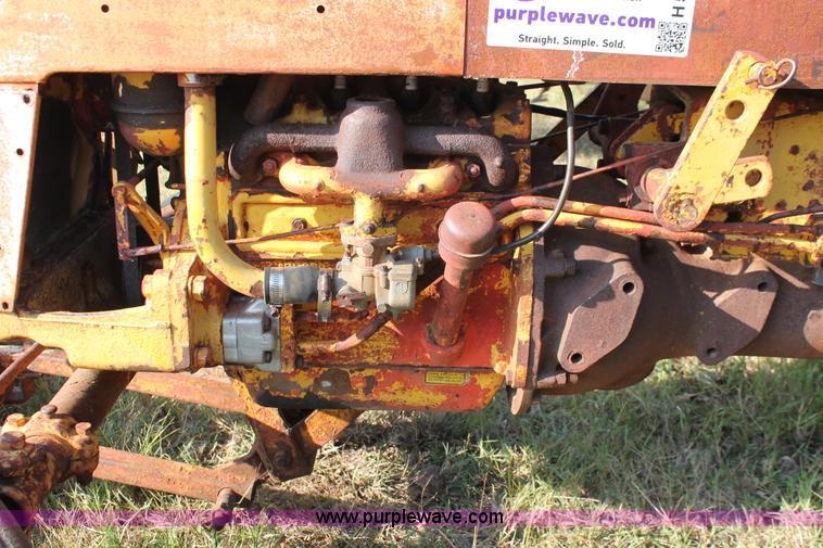 image for item H5588 1948 McCormick Farmall Cub Lowboy tractor with trencher