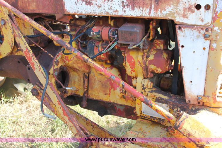 image for item H5588 1948 McCormick Farmall Cub Lowboy tractor with trencher