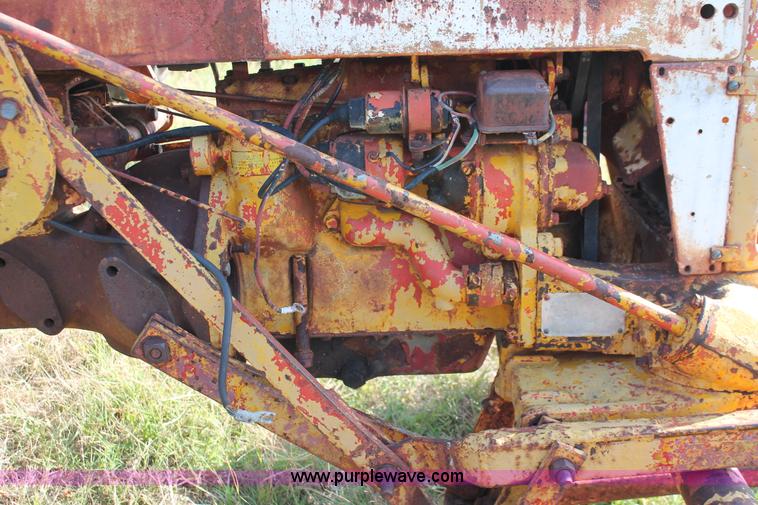 image for item H5588 1948 McCormick Farmall Cub Lowboy tractor with trencher