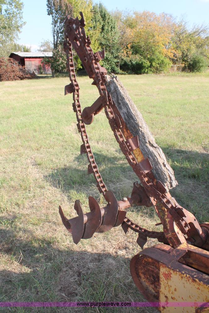 image for item H5588 1948 McCormick Farmall Cub Lowboy tractor with trencher