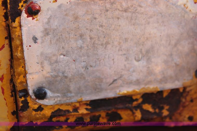 image for item H5588 1948 McCormick Farmall Cub Lowboy tractor with trencher