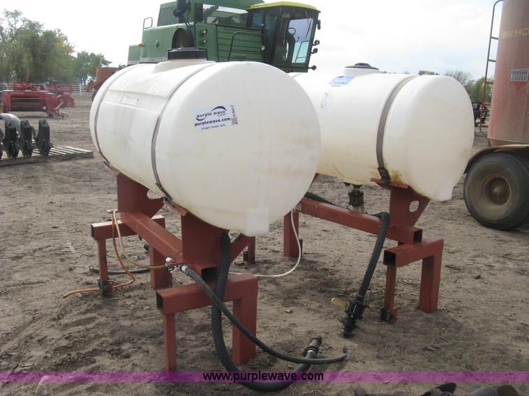 image for item H9417 (2) 200 gallon poly saddles tanks