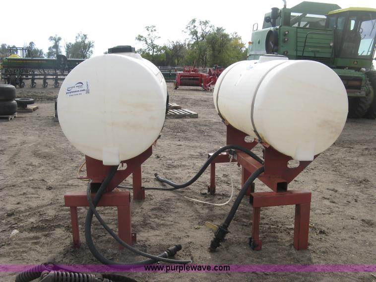 image for item H9417 (2) 200 gallon poly saddles tanks