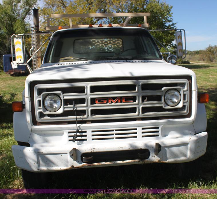 image for item H8816 1985 GMC TopKick 7000 winch truck
