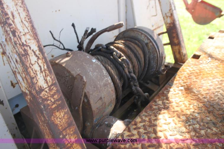 image for item H8816 1985 GMC TopKick 7000 winch truck