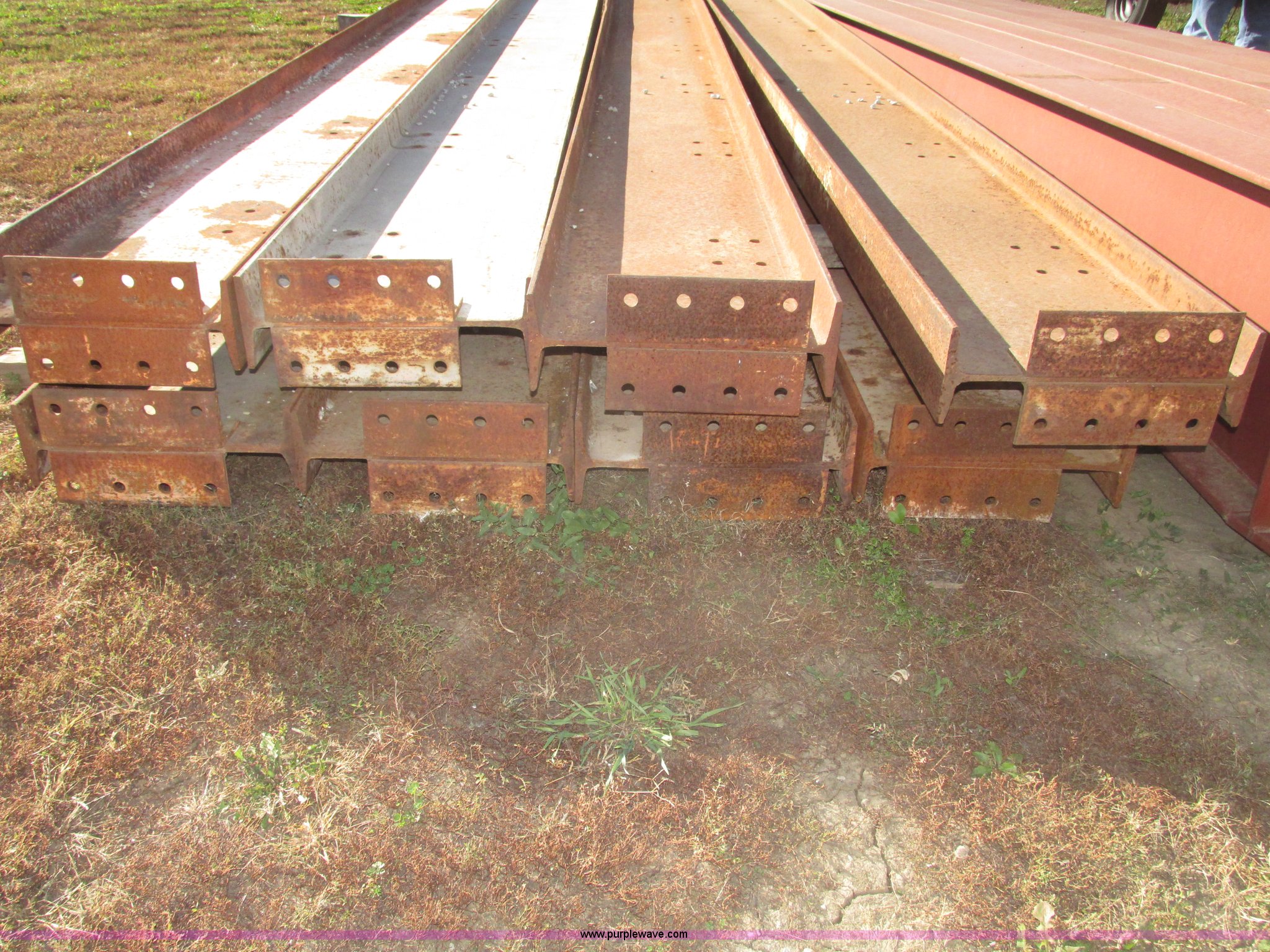 (8) red iron Ibeams in Falls City, NE Item G9896 sold Purple Wave