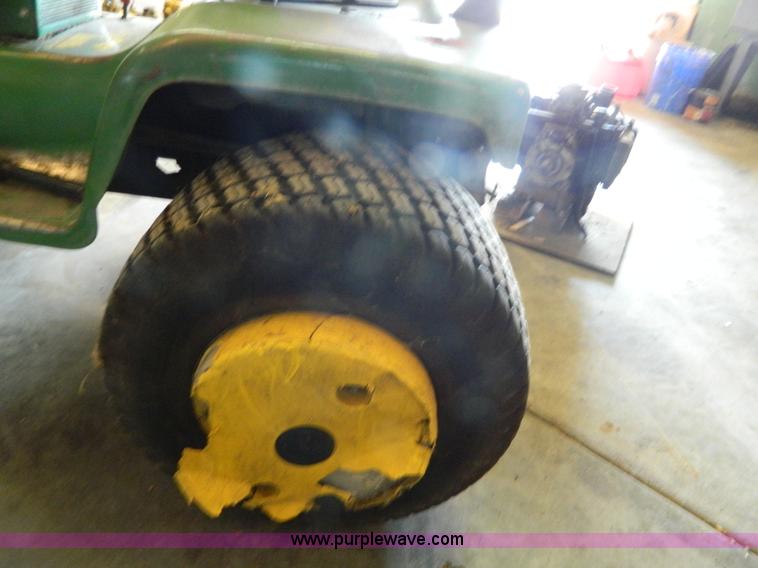 image for item AQ9405 John Deere 420 lawn mower