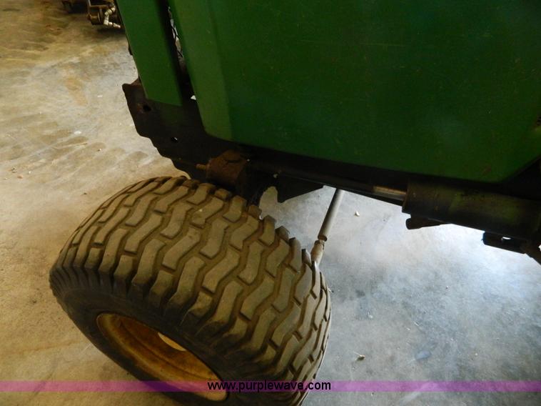 image for item AQ9405 John Deere 420 lawn mower