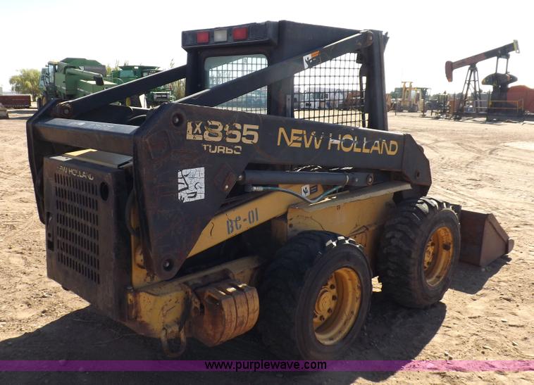 image for item H9011 1995 New Holland LX865 skid steer