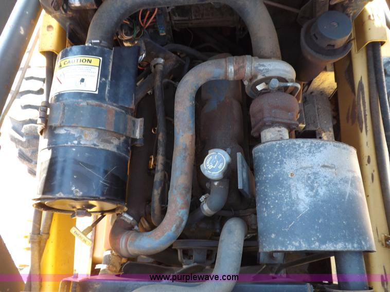 image for item H9011 1995 New Holland LX865 skid steer