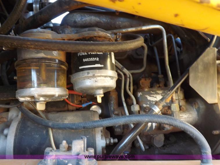 image for item H9011 1995 New Holland LX865 skid steer