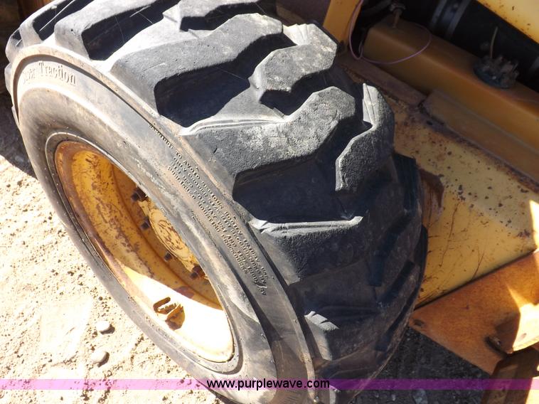 image for item H9011 1995 New Holland LX865 skid steer