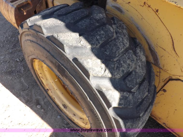 image for item H9011 1995 New Holland LX865 skid steer