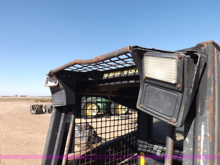 image for item H9011 1995 New Holland LX865 skid steer